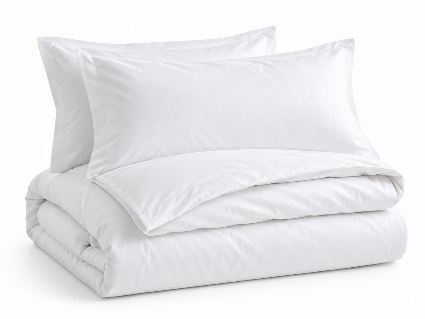 A folded white duvet cover with two pillow shams behind it